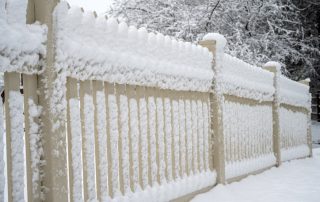 Fence covered with snow